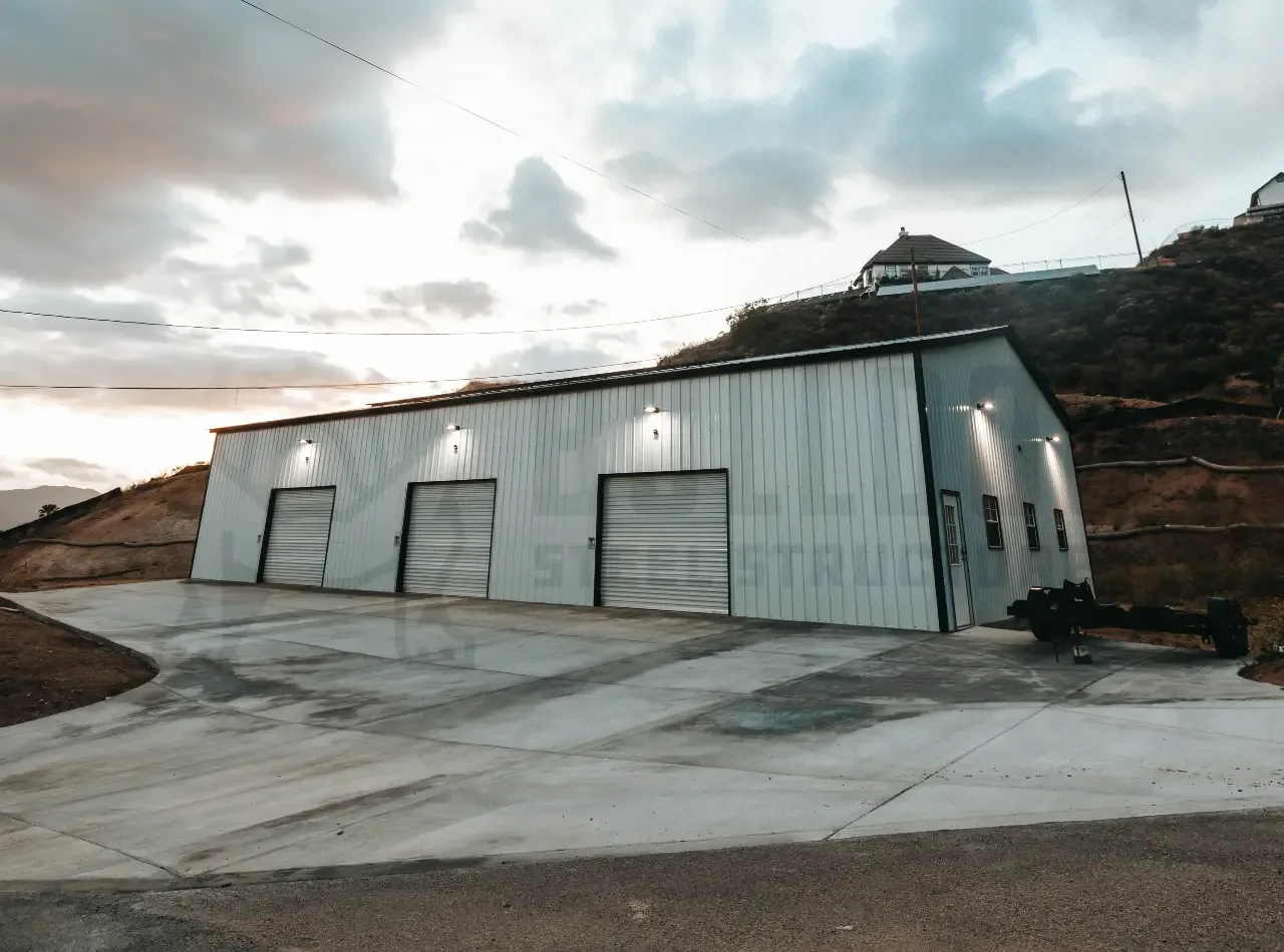 Commercial steel building with clear-span interior and loading doors serving a growing business