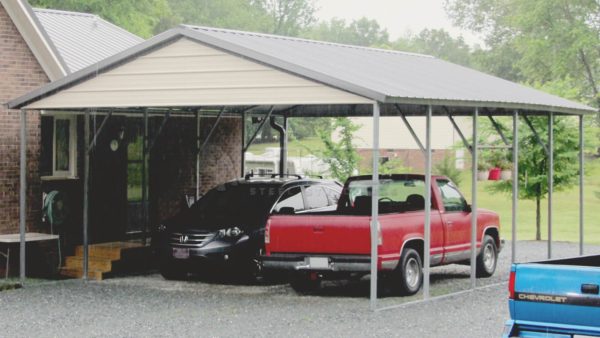 Carport with two cars parked under it.