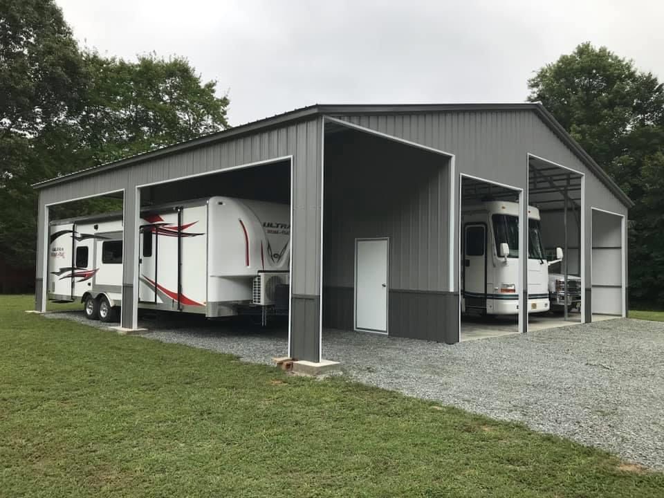camper parked in a custom gray metal barn
