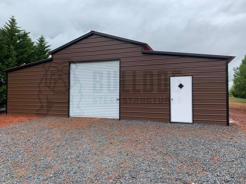 carolina barn with garage door and entry door